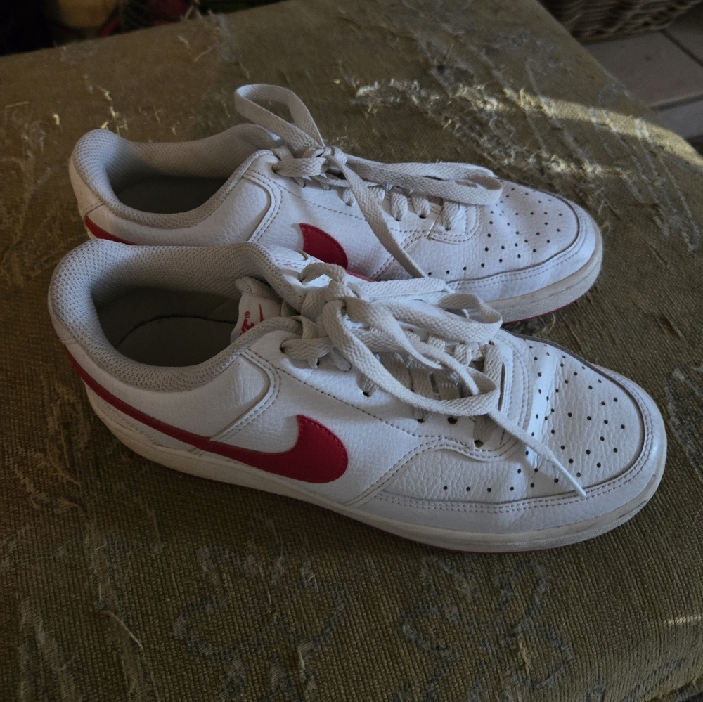 Red and white nike shoes